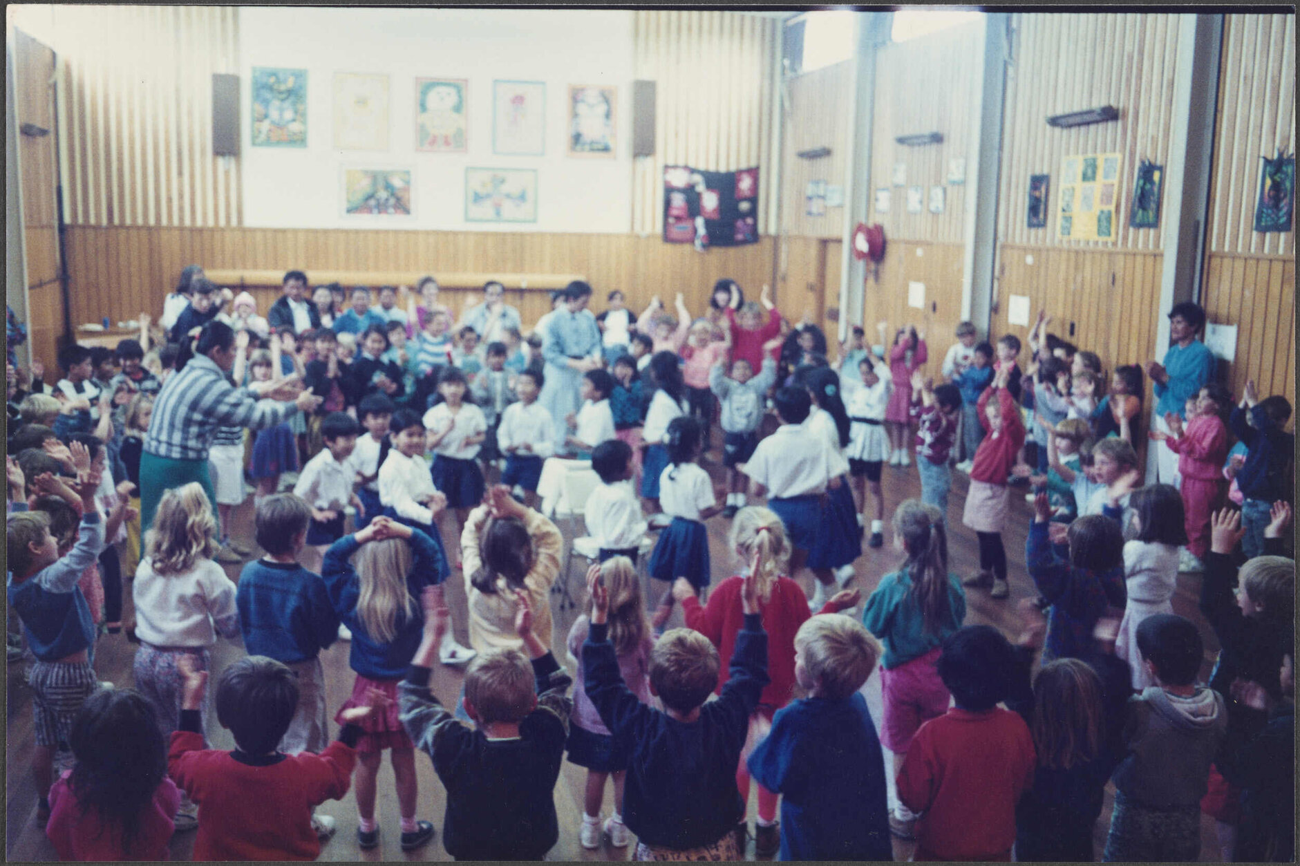 Cambodian children performing a circle dance at Brockville School