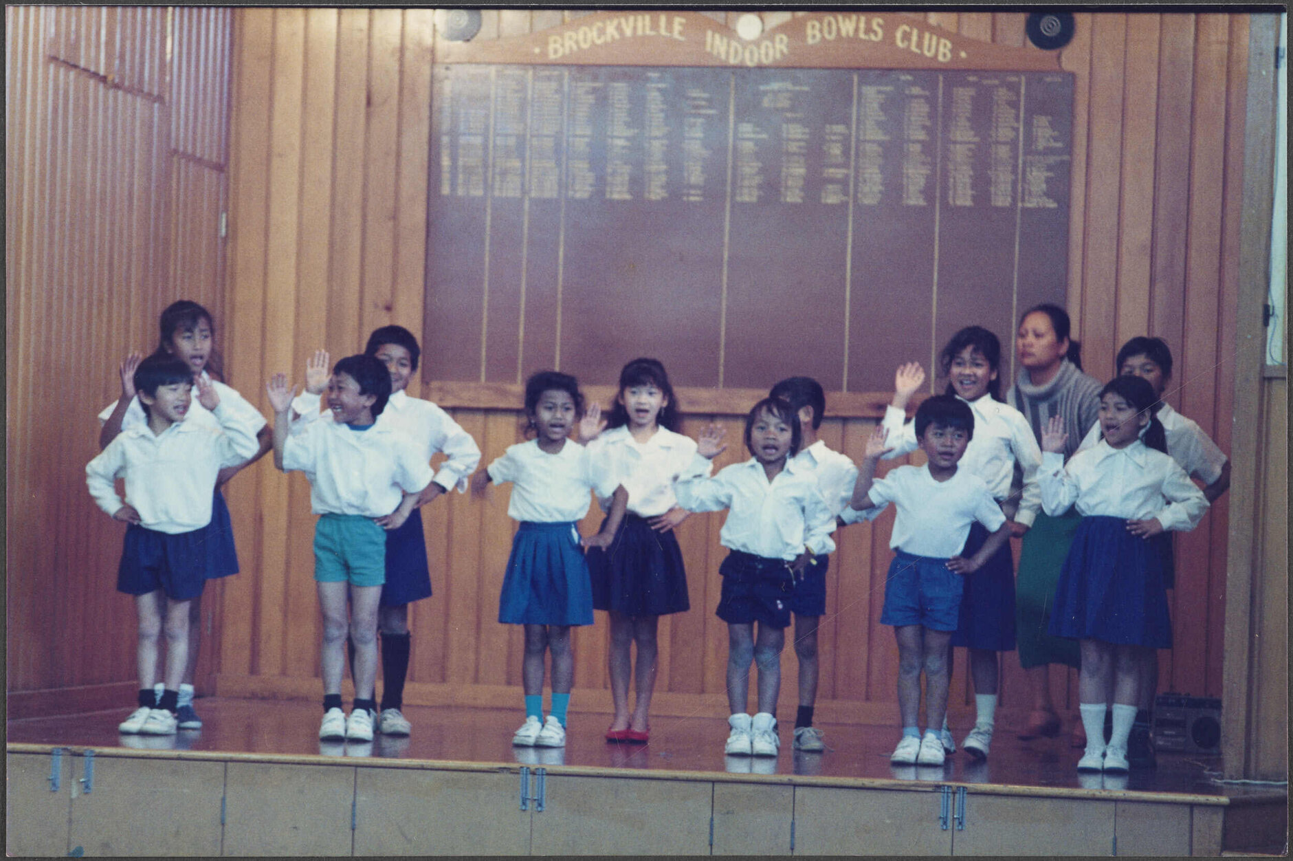 Cambodian children performing at Brockville School with their teacher Maly Chum in the background