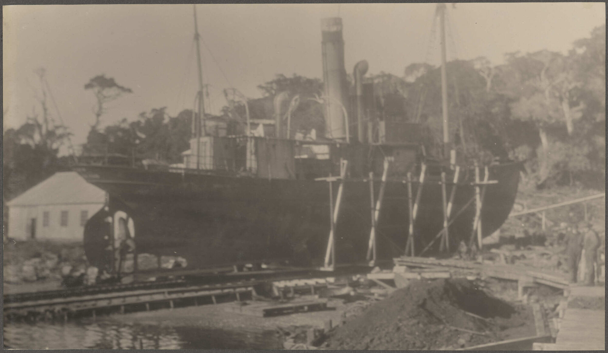 Ship undergoing repairs in dry dock