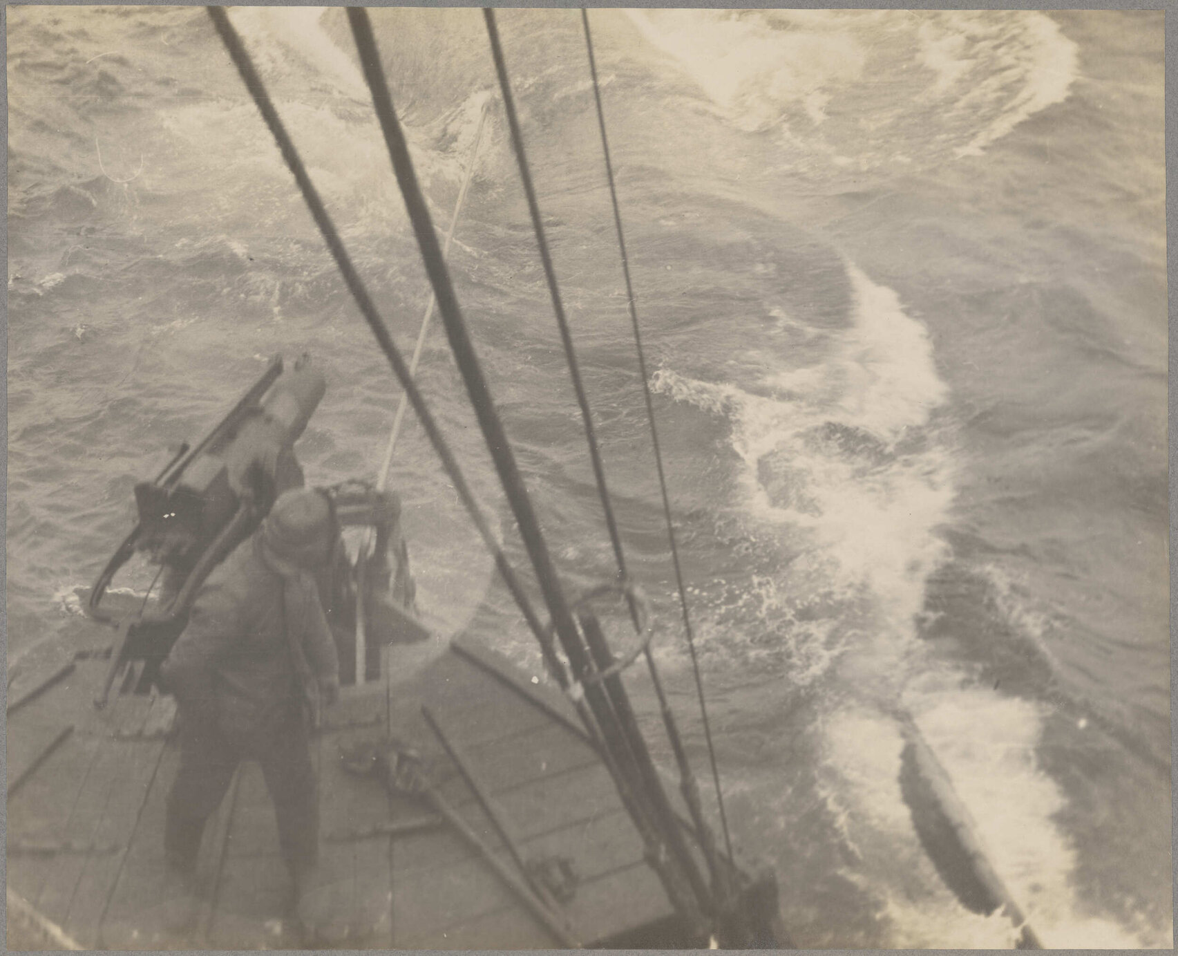 Whale-catcher trailing harpooned whale