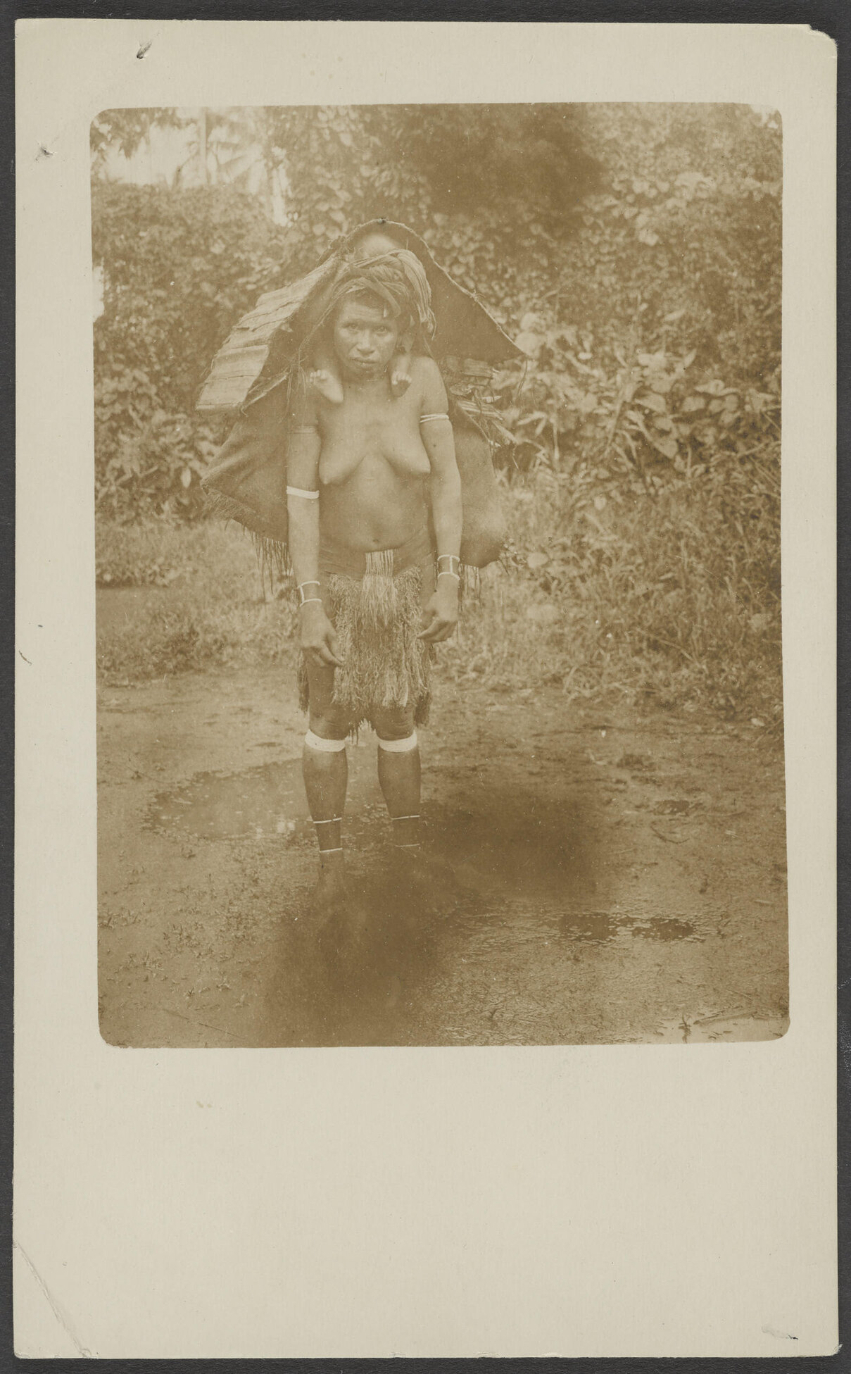 Young woman carrying load