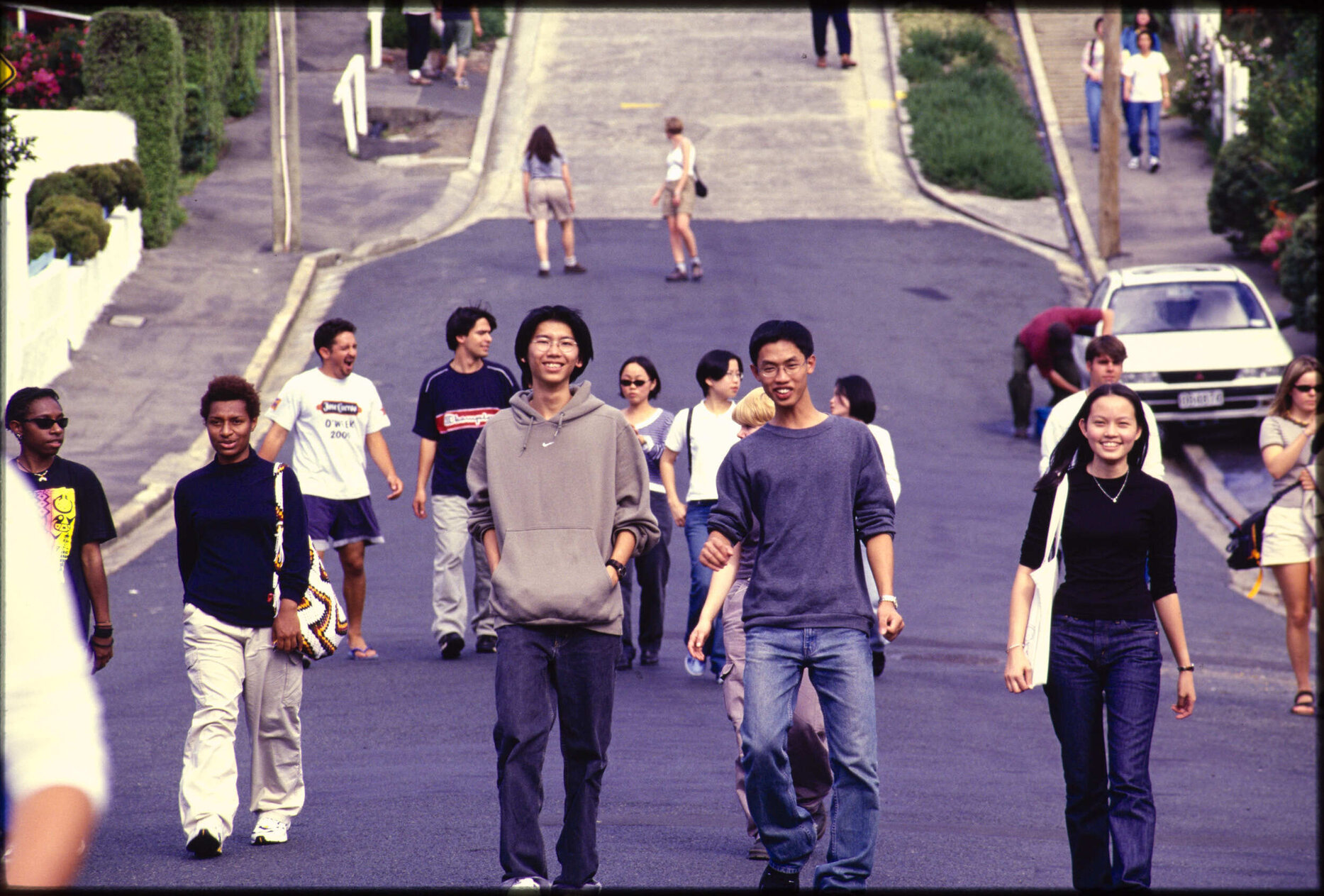 Group of people walking down Baldwin Street, Dunedin