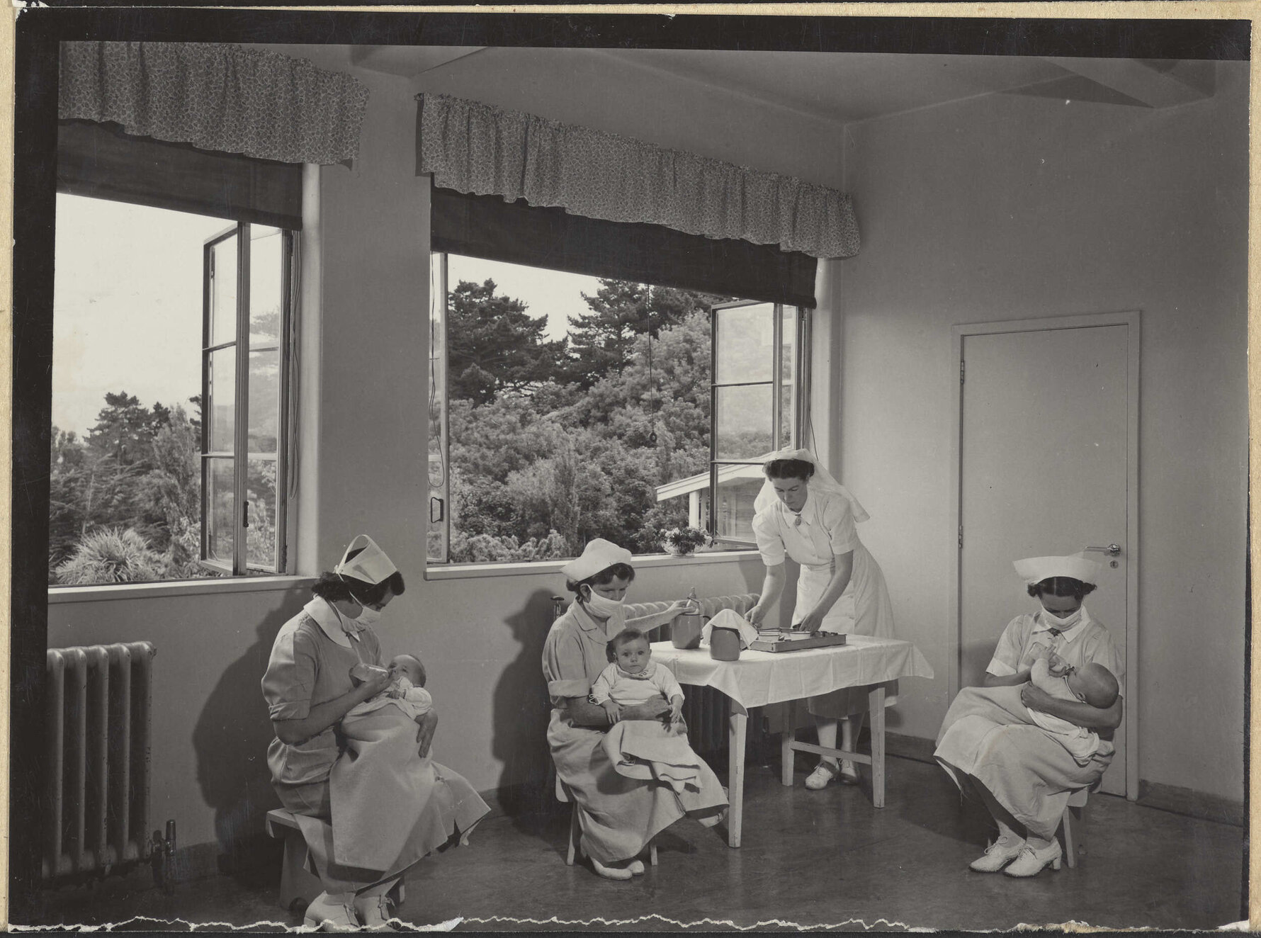 Nurses feeding babies