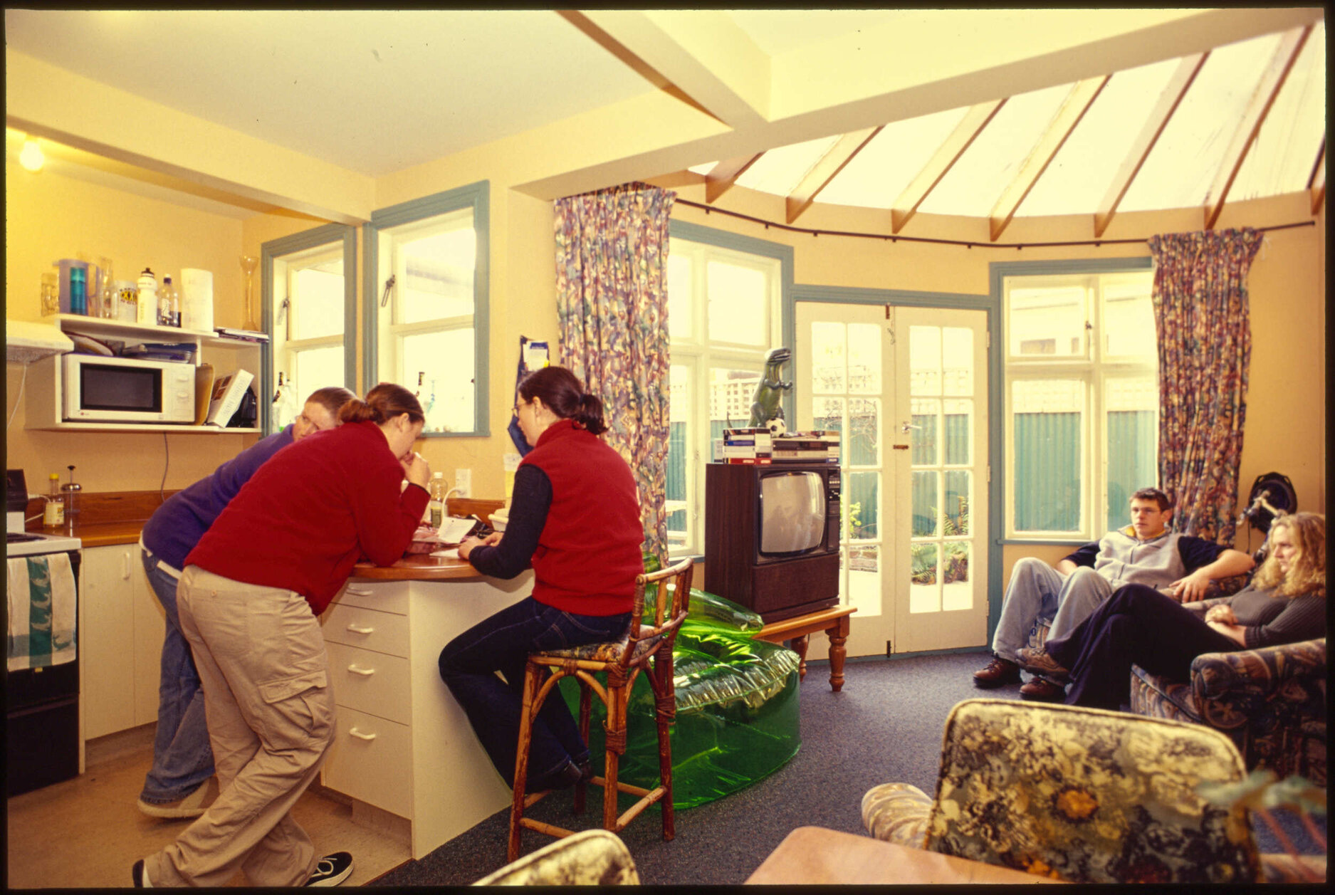 Students in kitchen and living area