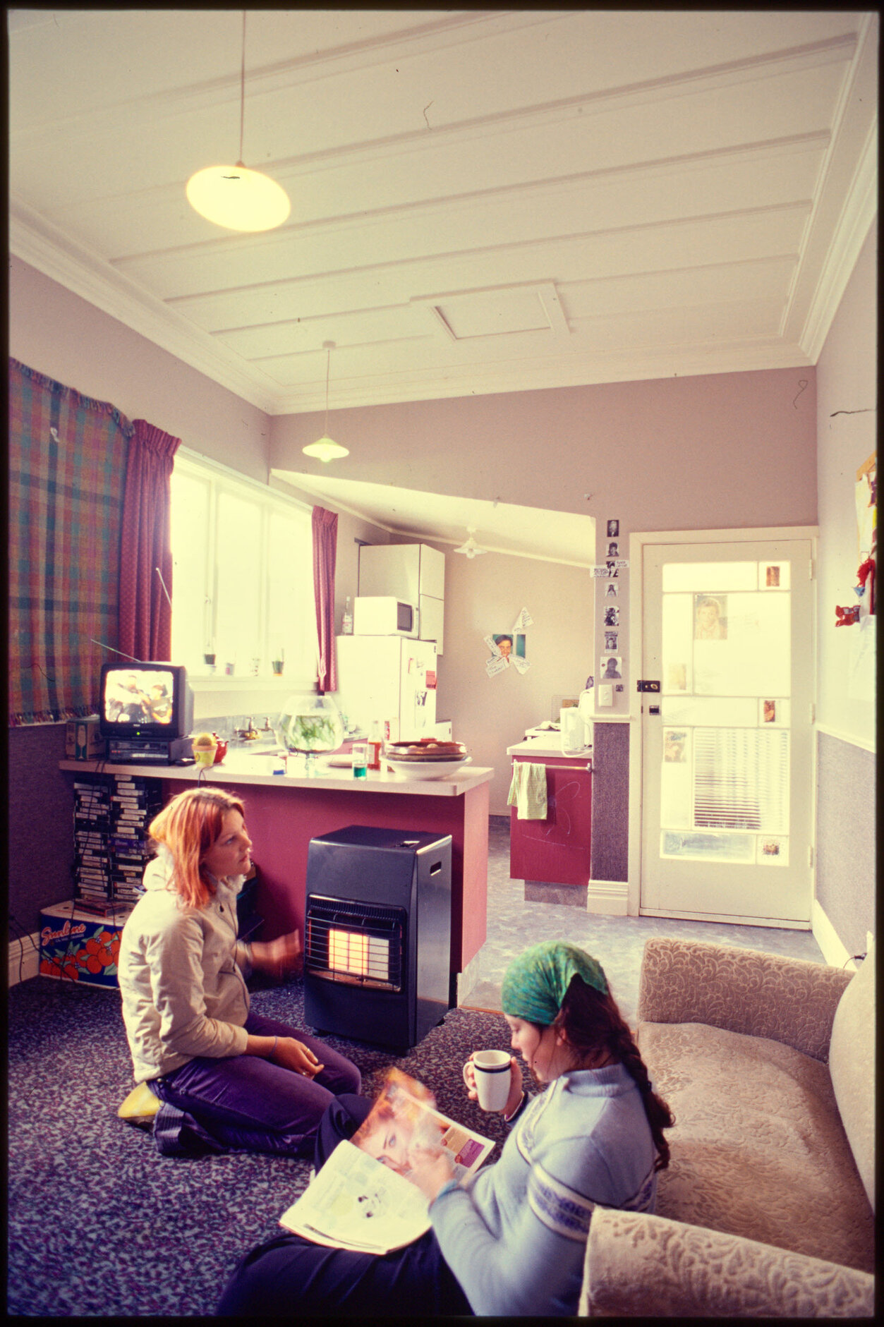 Students in kitchen and living area