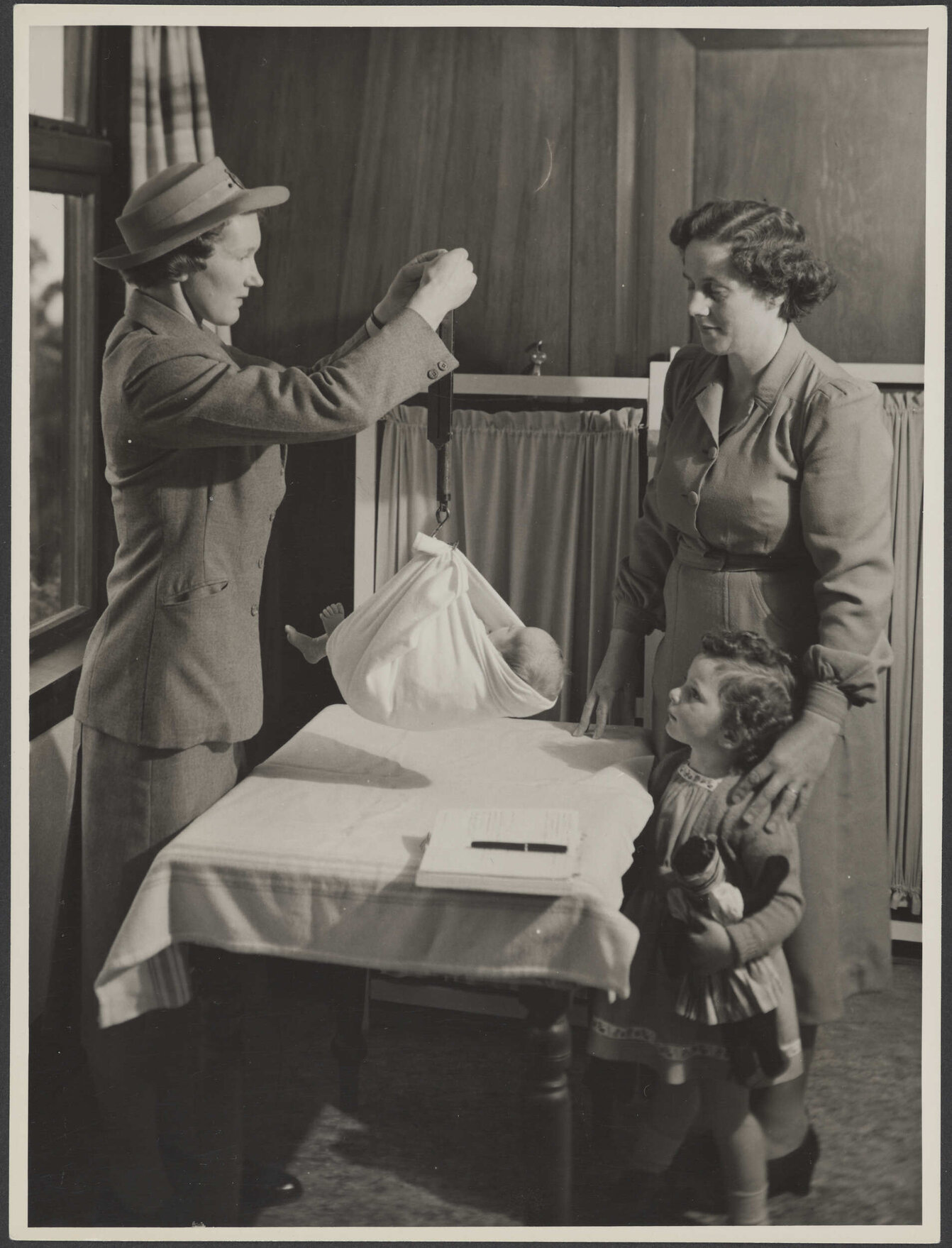 Baby being weighed
