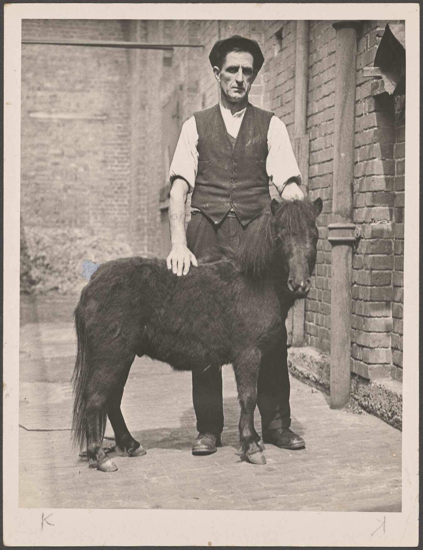 Man standing with a pony