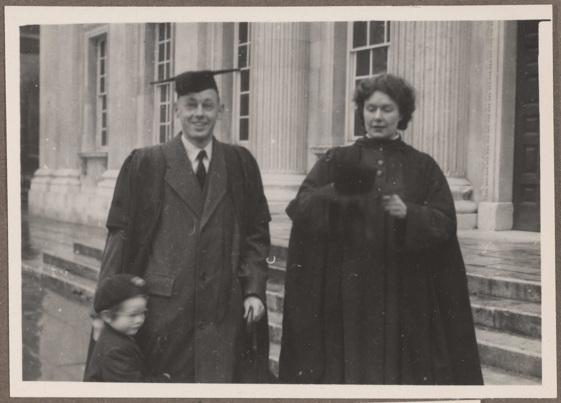 Brenda Slade with unidentified man and child outside the Senate House, Cambridge