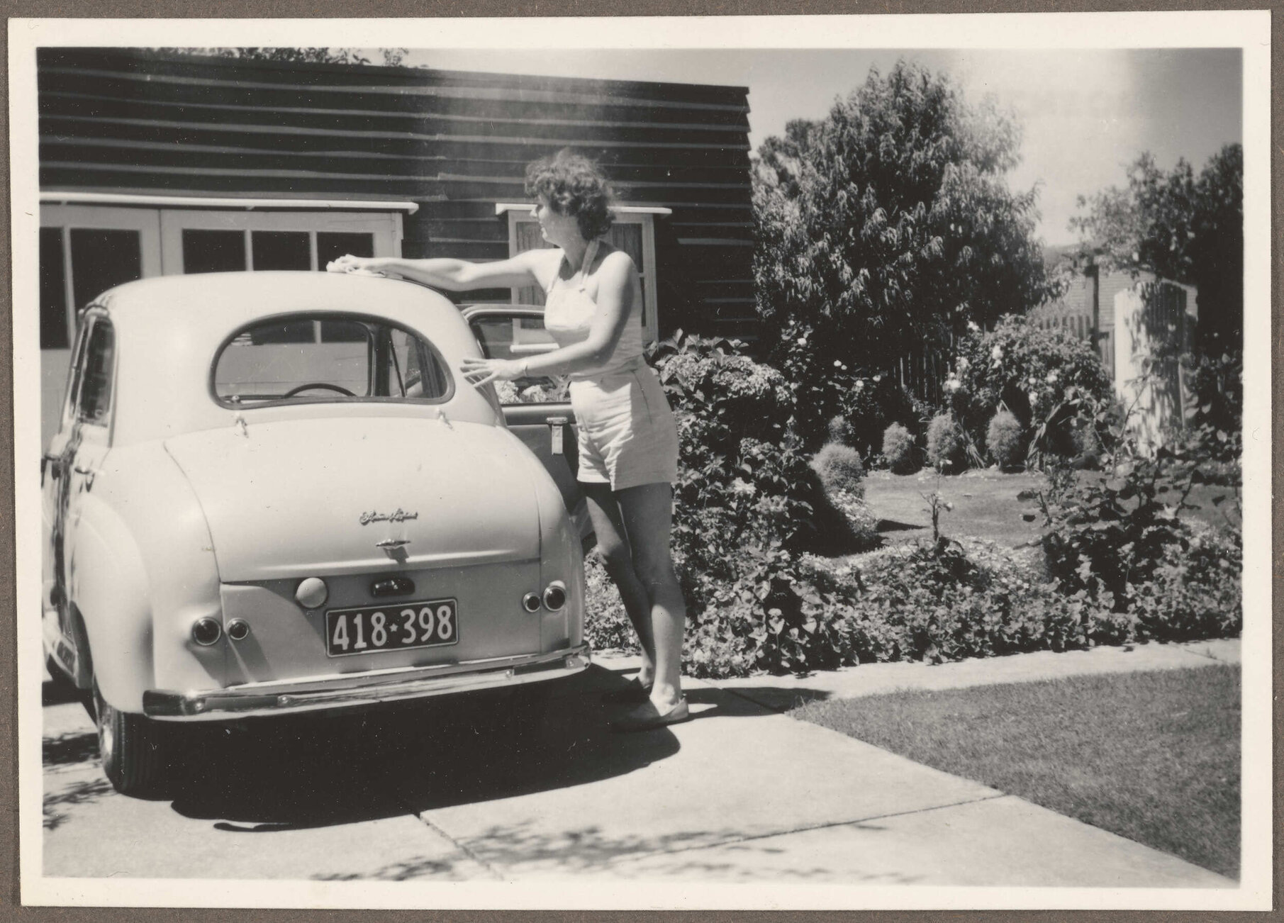 Brenda Slade cleaning Austin A30 car