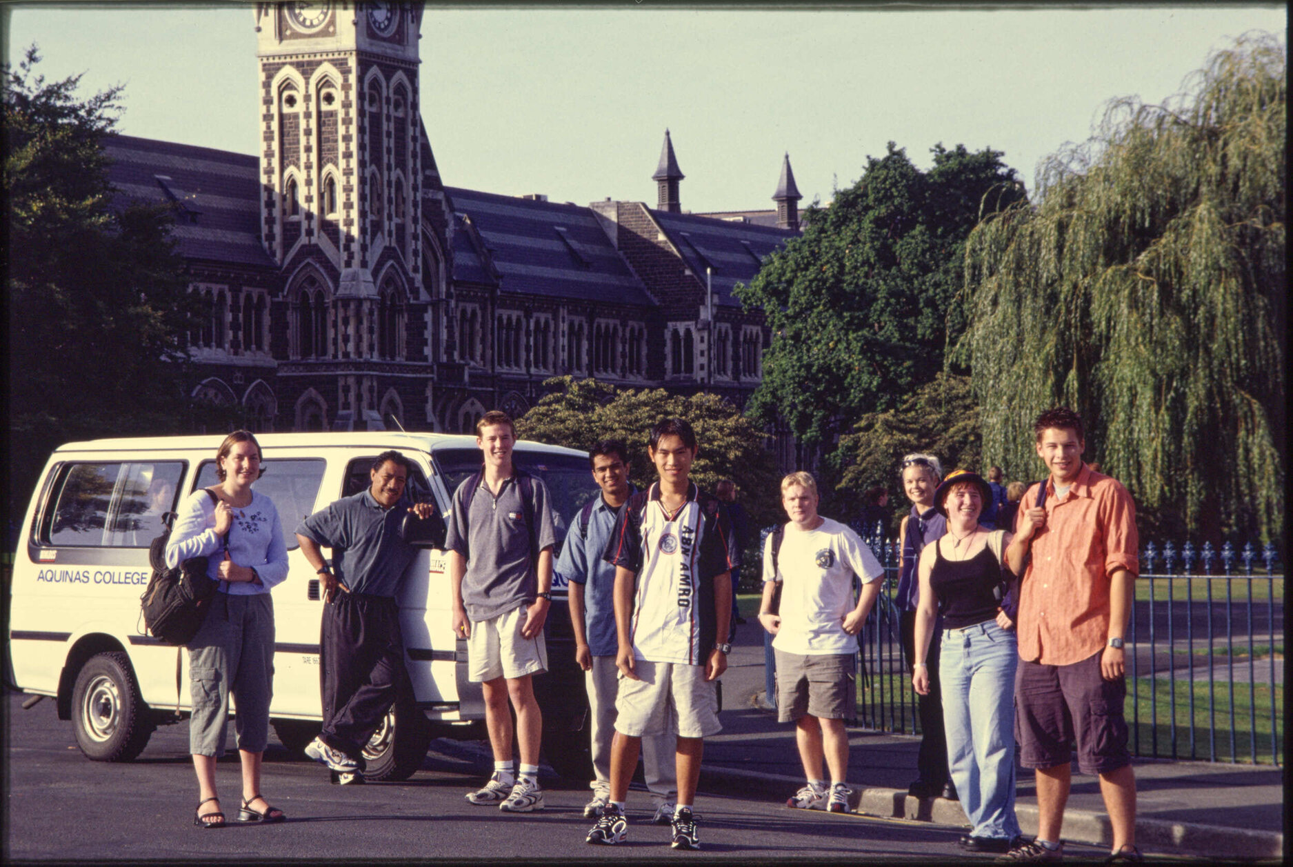 Aquinas College group with van