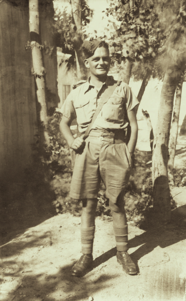 Noel Hulme standing by tree