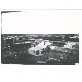 Building with verandah is National  Bank