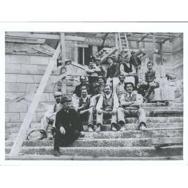 Construction, Mar[r] & McLeod plasterers working on building George Callister on steps near top in waist coat & white shirt