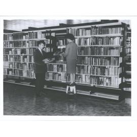 Book Stack, First floor (left. Richard W. Hlavac, right: Miss E. Robinson).