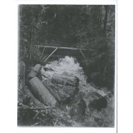 "When the big gate in dam is tripped, the creek in which the logs lie below is immediately filled bank and bank, and the logs ar