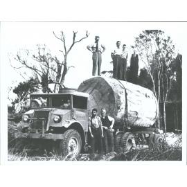 "on log: A.W. Read, Tom Greenwood & his son John, A. H. Reed. By truck Arthur West & Don McEwan".