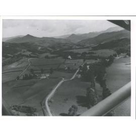 Gumtown now known as Coroglen. The river on the right is the Waiwawa, where over 220 million feet of timber was driven down from