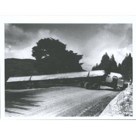 unable to turn corner on Junction of the bush road and highway. Assistance given  by another truck. 109-54 ft in length.