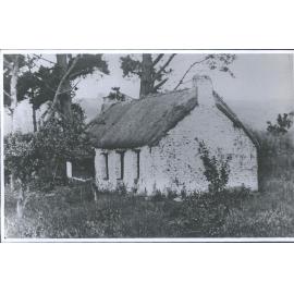 <unclear> Thatched house built by James Code