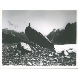Alex Graham Sitting on a large boulder
