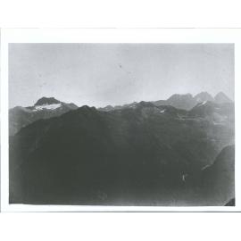 "Looking west from Summit of Livingstone Range about 1 1/2 miles South of Lake McKellar - Mt. Anau is in background on left of v