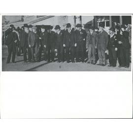 Group of early miners in the street