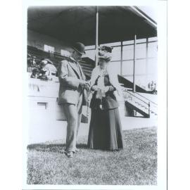 Comparing notes'. A snapshot in front of the [Wingatui] grand stand