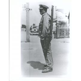 A Royal Marine on duty policing the town"