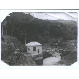 Whare Flat house and river