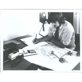 "A Lands + Survey draughtsman calculates plan areas using a planimeter"