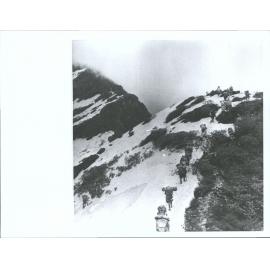 "Carrying out their plans to cross into the Barun by a 14,000 ft pass over the ridge between the Iswa and the Barun, the heavily