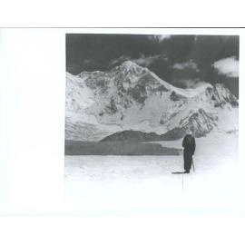 "G. Harrow surveys Baruntse (23,560'). The Summit of Baruntse was reached by the N.Z.H.E. on May 30 after a very difficult passa