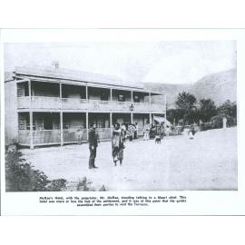 McRae's Hotel with the proprietor, Mr McRae, standing talking to a Maori chief