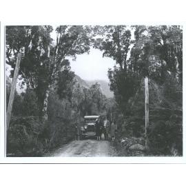 Unidentified group with car on Waiho Gorge Road