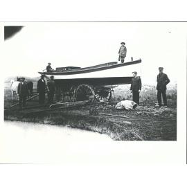Launching Motor Boat used to tow coal barge to Dredge