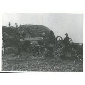 Smith's Traction Engine & workemen at Holm's stacks with threshing mill