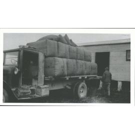 John Shield with total wool clip loaded on Nugget Burgess's International truck