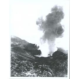 The massive steam cloud rising from the Waimangu Geyser seem from a position near southern crater