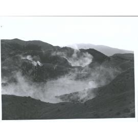 The site of the Waimangu Geyser with Black Crater, and Mt Tarawera in the distance