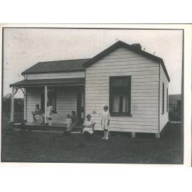 Family outside a house near Waimate