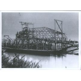 Dredge partially constructed with machinery in position