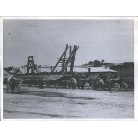 Dredge pontoon being moved by traction engines