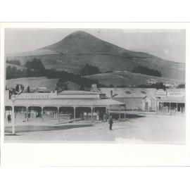 Street scene showing the business premises of M.S. McRitchie and J.H. Milligan & Co.