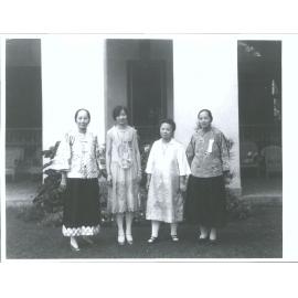 Four conference attendees or officials