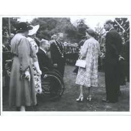 Masterton. Mayor E G Coddington introduces Mr V. MacFarlane-Laing (in wheelchair) to Q. E. II and Duke of Edinburgh