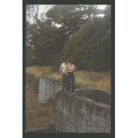 Dr. Tony Ruakere & Kathy Glass standing on the remains of what he identified as Te Whiti's house