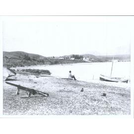 Man sitting on beach, Pembroke, Lake Wanaka