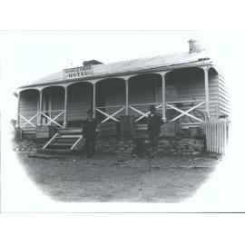 Two men and dog outside Shingle Creek Hotel