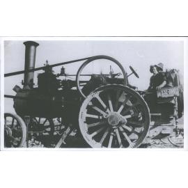 Tractor engine driving a wooden mill