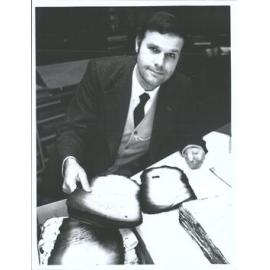 Wayne Nelson of National Archives examines files scorched in the 1952 Hope Gibbons fire